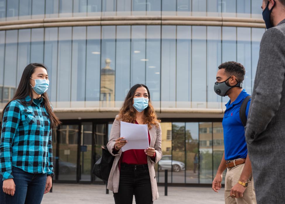 Students outside the building talking