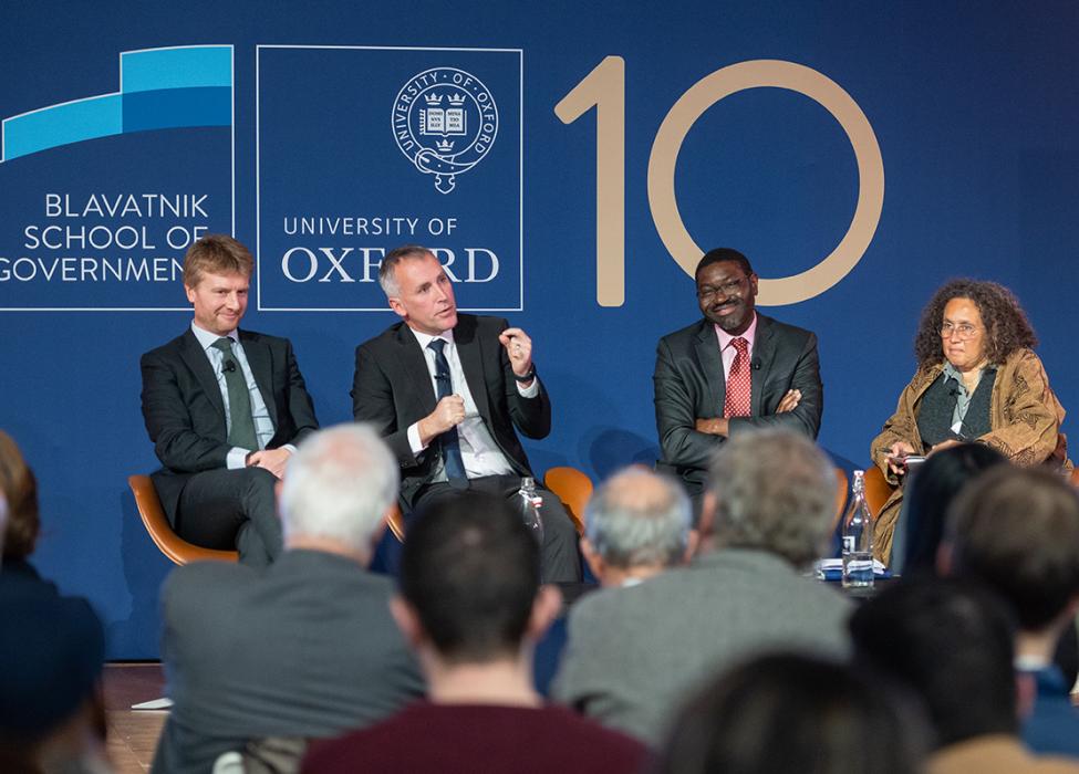 The panellists during the discussion on the background of the Blavatnik School 10 years logo